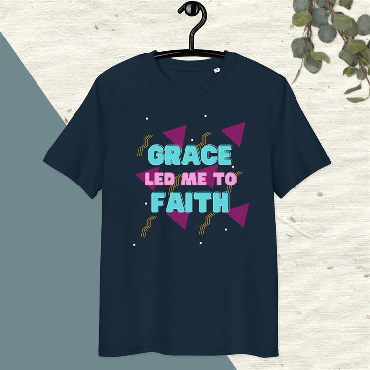 Navy blue t-shirt with retro '80s pattern and text Grace led me to faith in pink and aqua