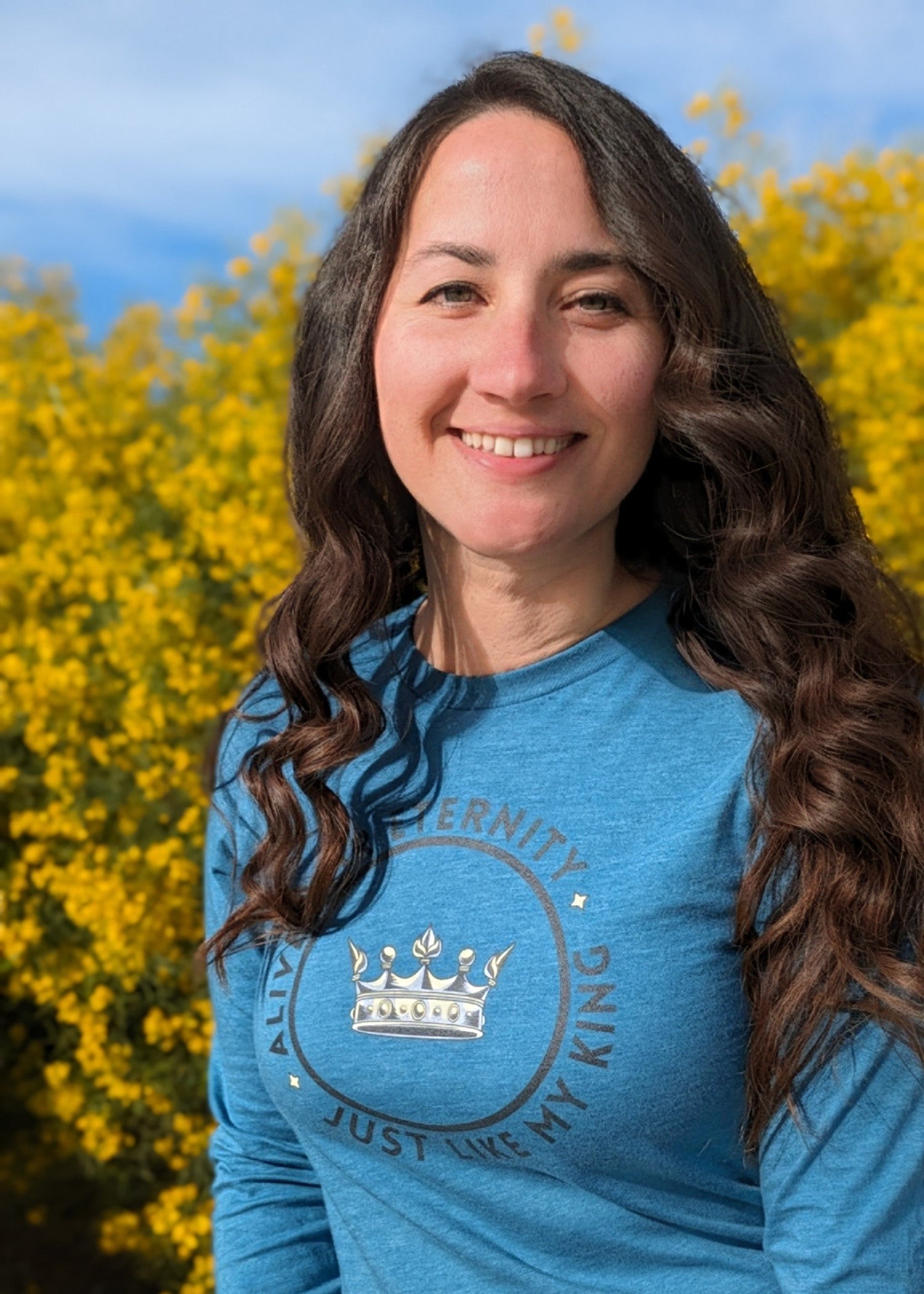 Woman wearing blue Christian faith inspired graphic shirt