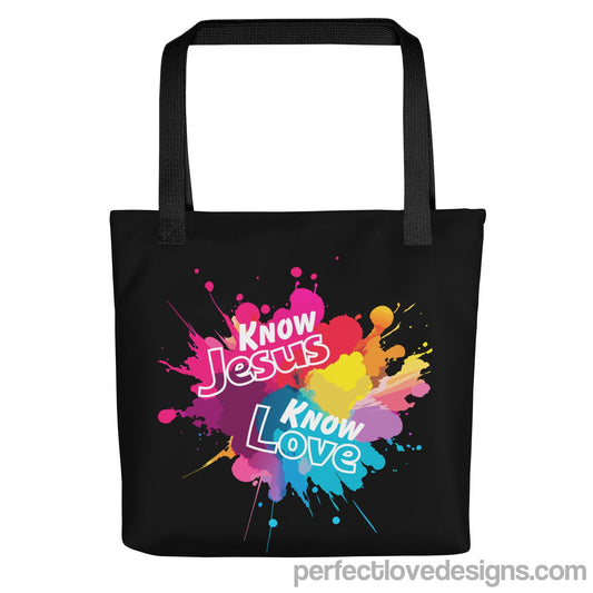 Know Jesus Tote Bag-black background with white text on colorful paint splash print by Perfect Love Designs